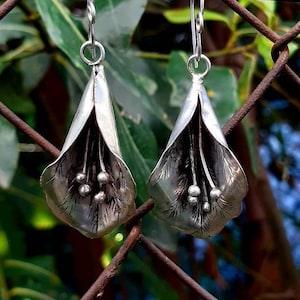 Silver arum flower earrings with dangling beads and tassels