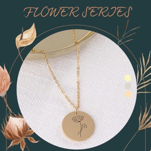 Gold floral charm necklace with thin chain and engraved round pendant