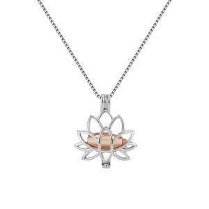 Silver lotus flower cremation ashes necklace with small glass center and chain