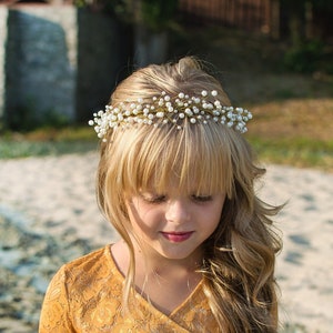 Gold pearl headband with small bead clusters and a curved band