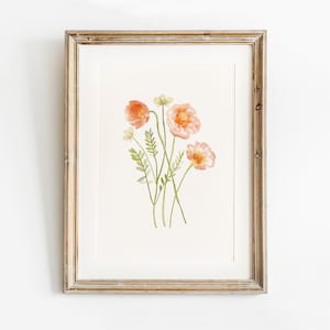 Framed watercolor floral print with pink poppy-style blossoms and green stems
