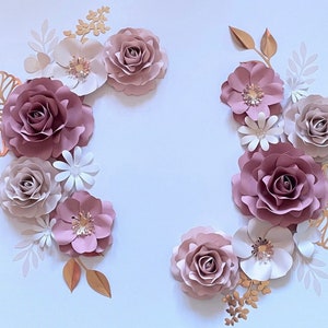 Mauve and rose-gold paper flower wall set with mauve roses and white blossoms, gold accents