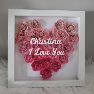 Framed shadow box with pink paper roses and heart design, text inside