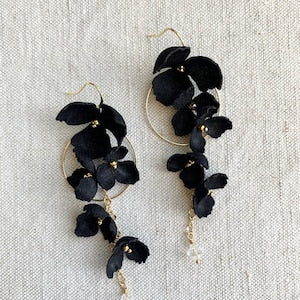 Gold hoop earrings with black silk floral drop clusters