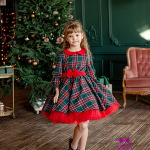 Girls tartan Christmas dress with red bow and red-trimmed flared skirt