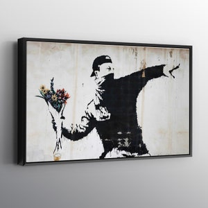Wall art canvas print of Banksy-style flower thrower silhouette with flowers, framed
