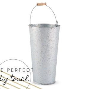 Large galvanized metal bucket vase with rope handle, light gray finish