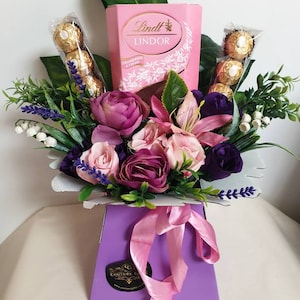 Chocolate bouquet gift hamper with pink and purple silk flowers and Lindt Lindor chocolate treats