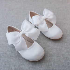 Girls white satin Mary Jane shoes with large bow at ankle