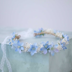 Blue flower crown headband with small blue blossoms and baby's breath detail