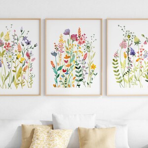 Three framed wildflower watercolor prints with bright multicolor blooms