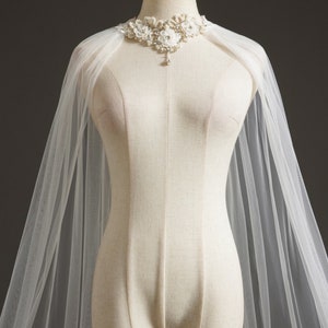 Sheer ivory wedding cape top with floral pearl neckline topper