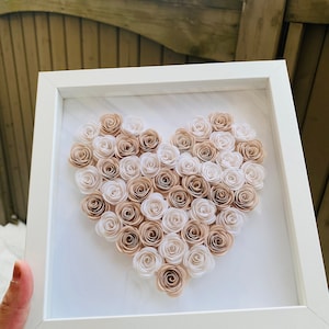 Heart-shaped shadow box with cream hand-rolled paper rose flowers
