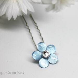 Pale blue fabric flower hair pin with clear crystal center and metal pin back