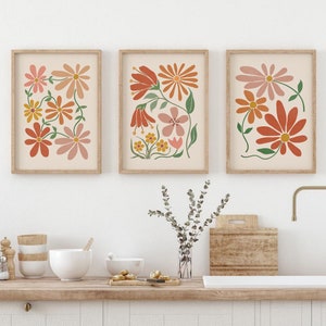 Set of 3 framed boho floral prints with abstract flower designs in terracotta tones