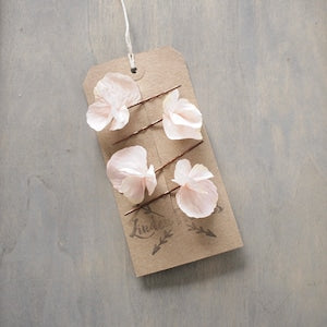 Pale pink hydrangea-style fabric hair flower pins, multiple blossoms