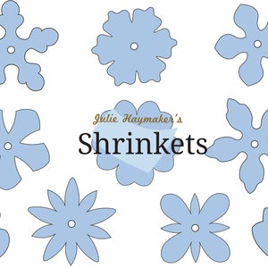 Blue flower die-cut shapes with small round center holes