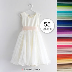 Ivory flower girl dress with satin bodice, tulle skirt, short sleeves, round neckline