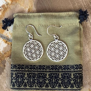 Silver flower of life drop earrings with round geometric pattern and hooks