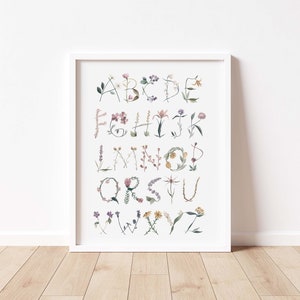 Wildflower alphabet poster with colorful letter illustrations in a white frame
