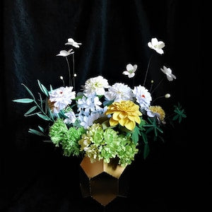 3D paper flower bouquet with yellow rose, blue and white blooms, green foliage in box