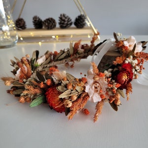 Orange dried flower hair crown with ribbon ties and mixed autumn blossoms