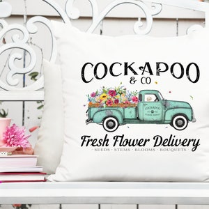 Cream decorative sign with Cockapoo lettering and turquoise flower delivery truck graphic