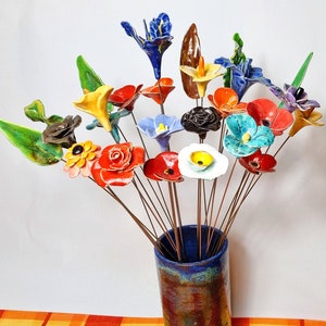Handmade ceramic flower bouquet with assorted colorful blooms in glass vase