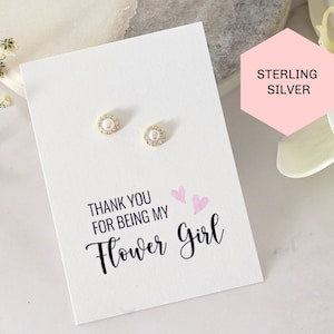 Sterling silver tiny pearl halo stud earrings on thank-you flower girl card