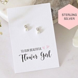 Tiny flower pearl stud earrings, sterling silver on gift card