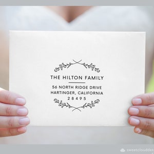 Floral envelope address template on white envelope with centered address and floral border