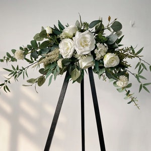 White and green silk rose and eucalyptus flower swag with long hanging ribbons