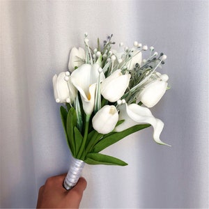 White tulip-style wedding bridal bouquet with greenery and silver-wrapped stems