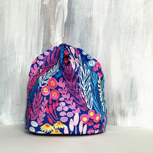 Colorful floral beanie hat with leaf and flower pattern