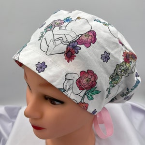 Floral scrub cap in light background with ribbon ties, side print