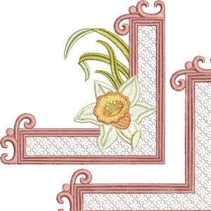 Daffodil flower embroidery corner with pink scroll frame and white lace fill