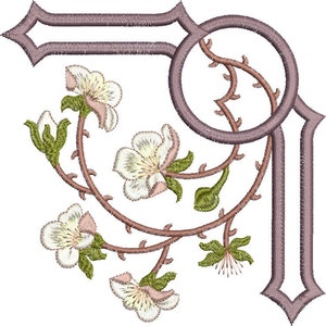 Embroidered corner motif with circular ring, vine, and white flowers on dark outline