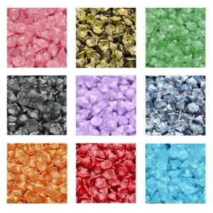 Pressed glass flower cup beads, assorted colors, small 1mm hole beads close-up