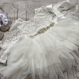 White lace long-sleeve dress with tulle tutu skirt and satin bow detail