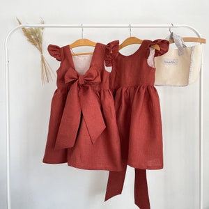 Terracotta boho flower girl dress for toddler with bow-front and tied sash