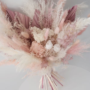 Blush pink dried flower bridal bouquet with pampas grass and feathery plumes
