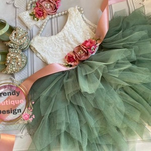 Sage green flower girl dress with lace bodice and tiered tulle skirt, floral appliques