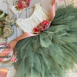 Sage green flower girl dress with lace bodice and tiered tulle skirt, floral appliques