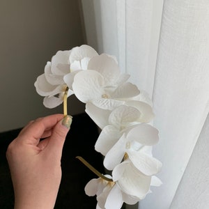 White flower headband with large hydrangea-style blooms and petal details