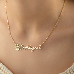 Gold-tone necklace with small flower charm and cursive 'Always' pendant