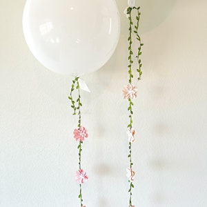 Pink and green flower vine garland string with small blossoms
