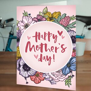 Mother's Day card with colorful floral wreath and 'Happy Mother's Day' message