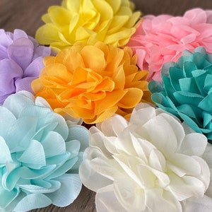 Flower bud collar with layered fabric blossoms in yellow, pink, teal, lavender, white