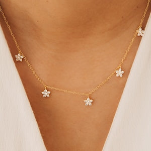 Gold-tone dainty necklace with three small diamond-like flower charms