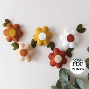 Felt floral garland PDF pattern with felt flowers and leaf accents on a string